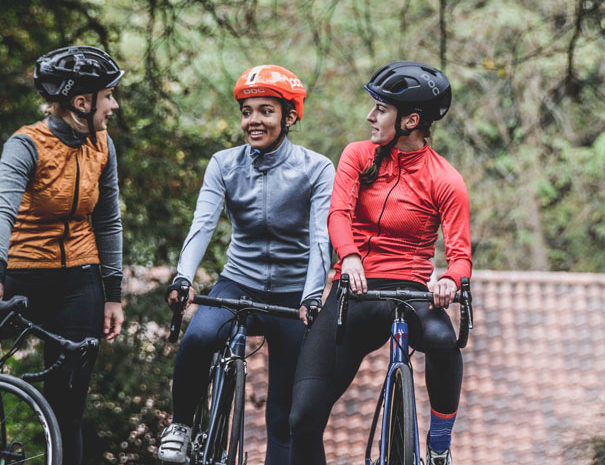 three female cyclists photo by Coen van den Broek on Unsplash - crop - Copy